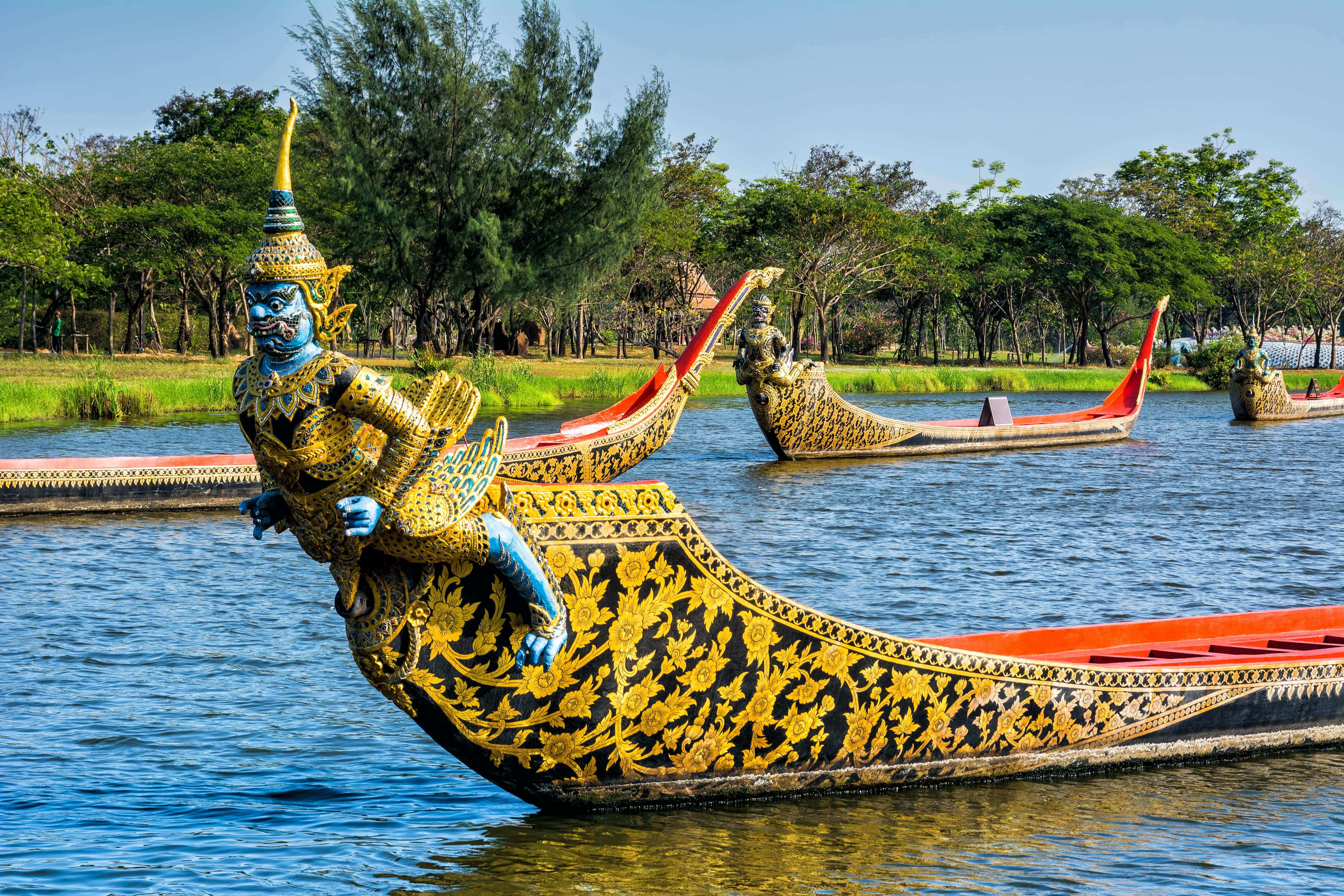 Ancient Siam park, Royal Water-Course Procession, decorated wooden thai boats on pond closeup.Bangkok, Thailand.